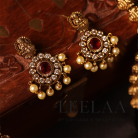 Premium Temple Ganapathi & Lakshmi Motif Haram with Kemp Stones, Pearls & Earrings Set.3 Logo