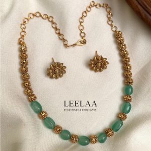 Aquagreen and golden beads choker with studs